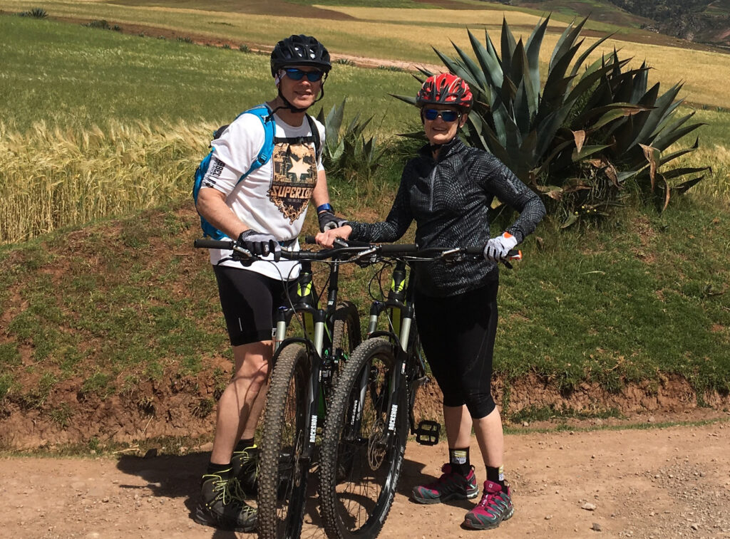 couple with bikes on the side of the road