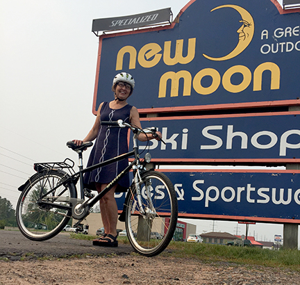 Allison Slavik of Cable, WI, poses with her new Uptown Breezer assembled at New Moon.