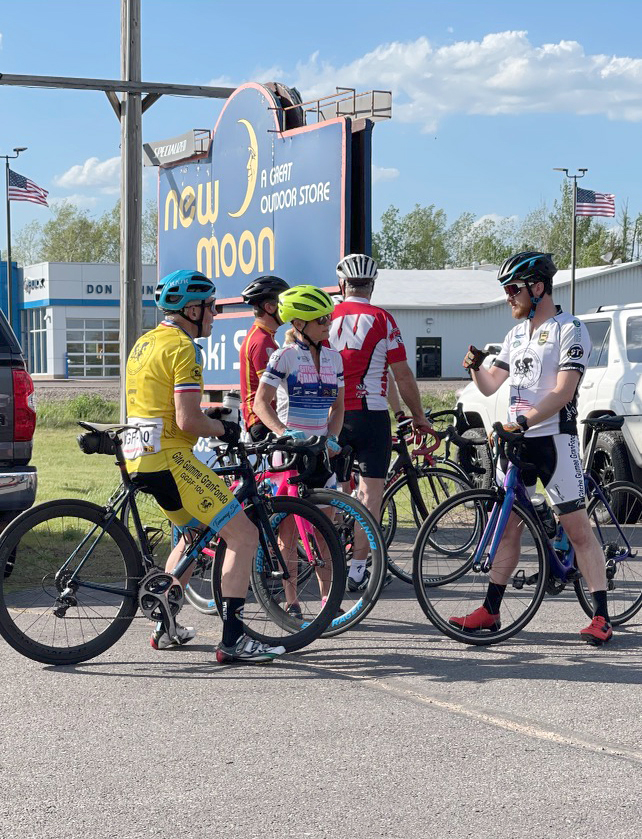 Road riders discuss the route