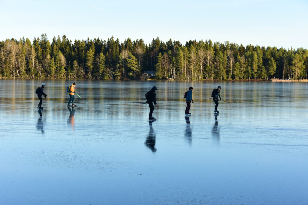 A group of friends nordic skating in Sweden