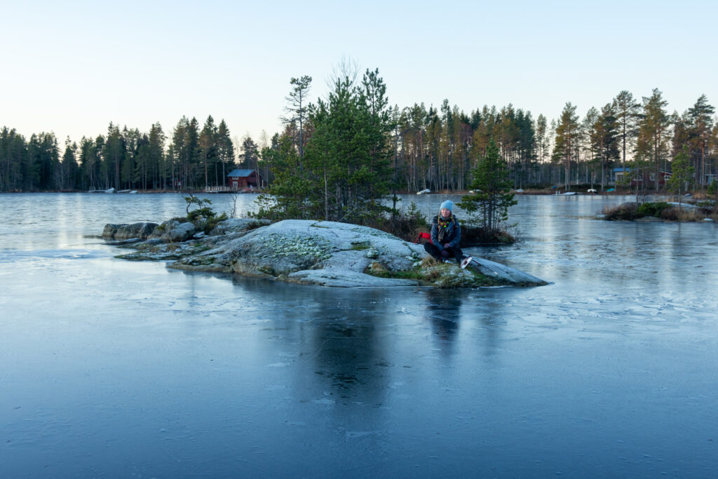 taking a break on a river island while nordic skating