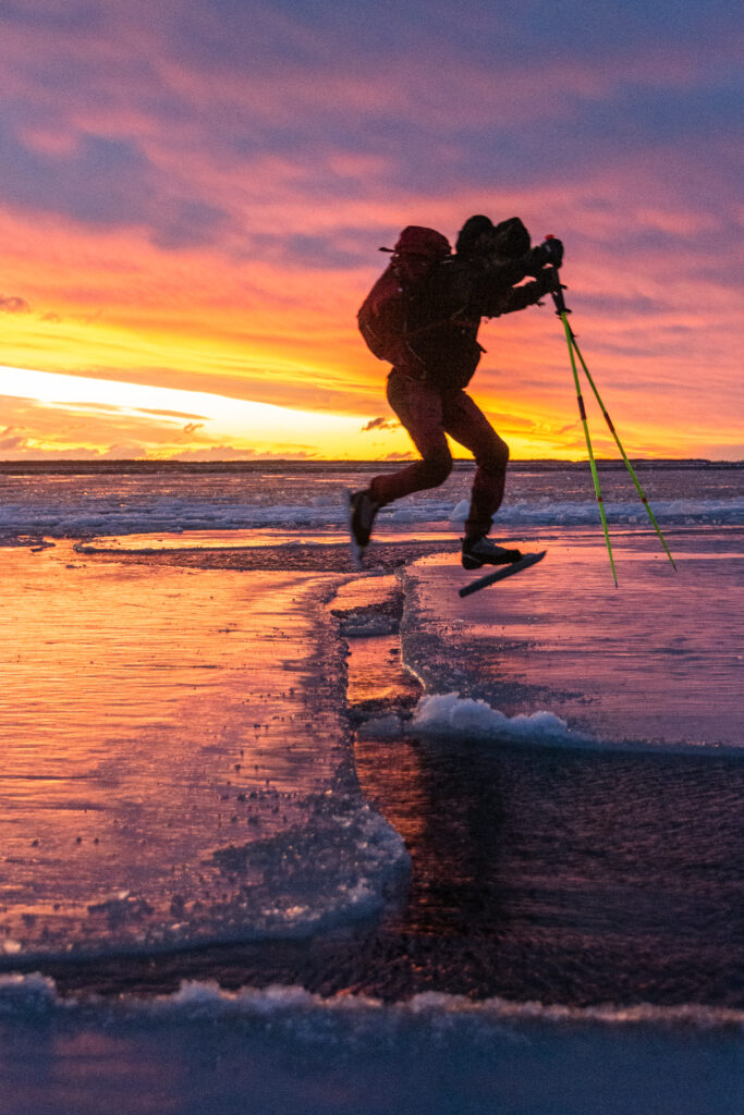 Jumping over cracks in the ice near the Baltic Sea in Sweden