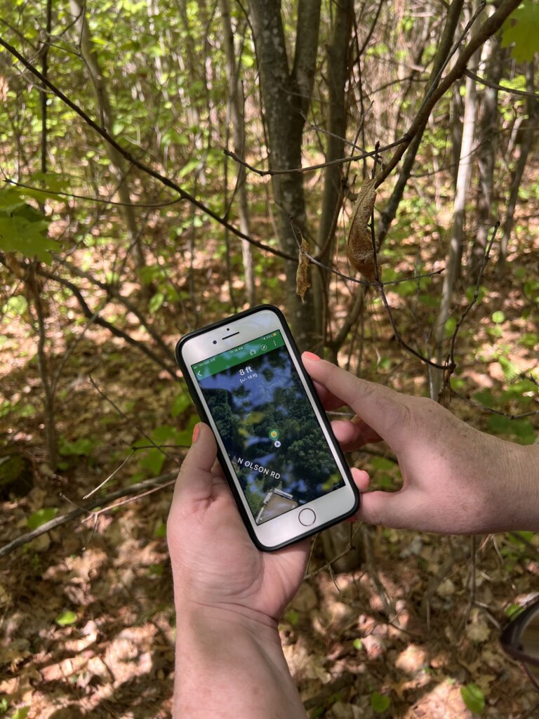 Stepping off the trails to find a geocache.