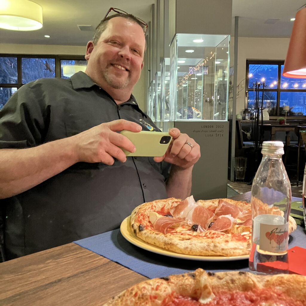 Chris at the pizzeria in Lake Bled.