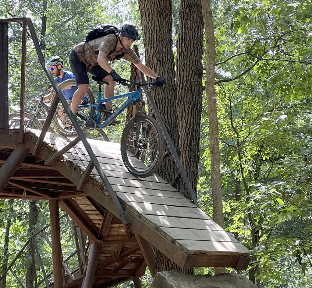 Chris Hecker, US Ski Team wax tech, dropping off a bridge in Bentonville, AR