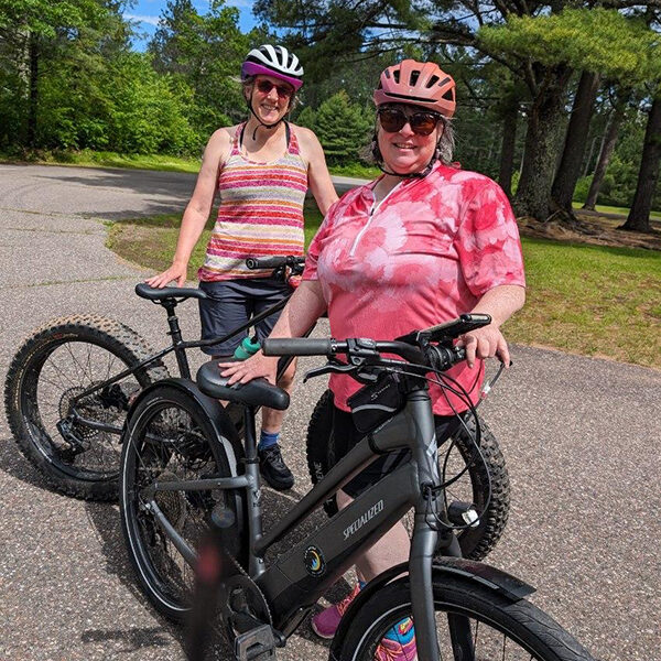 Kristy and Judy take off on the bike path in Manitowish Waters.